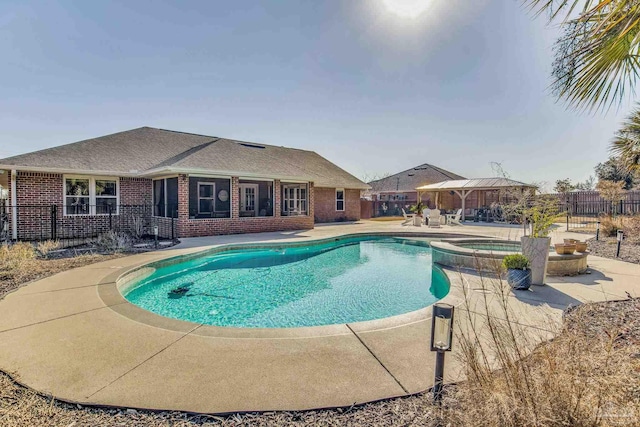 view of pool with an in ground hot tub, a gazebo, and a patio