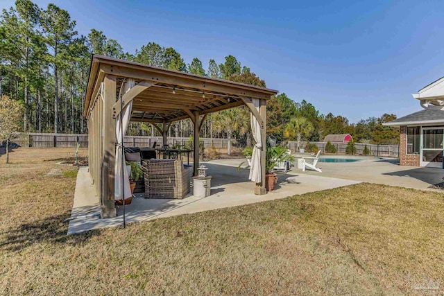 view of yard with a fenced in pool and a patio area