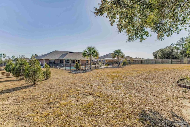 view of yard featuring a fenced in pool