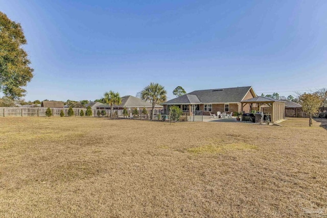 view of yard featuring a gazebo and a patio area