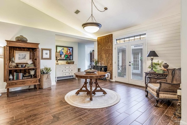 sitting room featuring vaulted ceiling, dark hardwood / wood-style flooring, and french doors