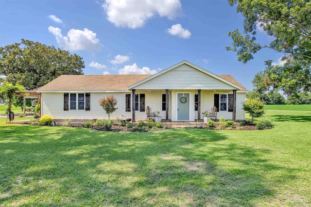 single story home with covered porch and a front yard