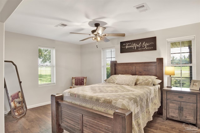 bedroom featuring ceiling fan and dark hardwood / wood-style floors