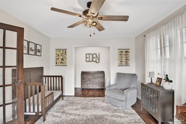 bedroom with dark hardwood / wood-style floors