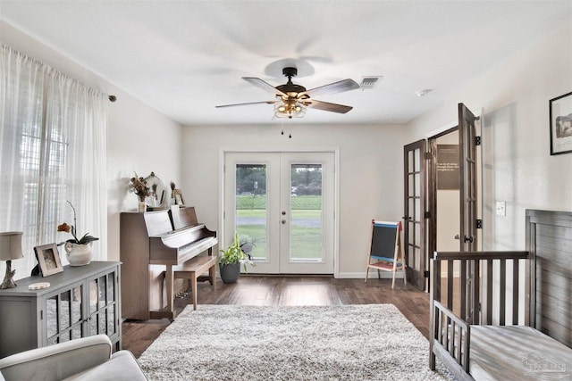 interior space featuring french doors, ceiling fan, and dark hardwood / wood-style flooring