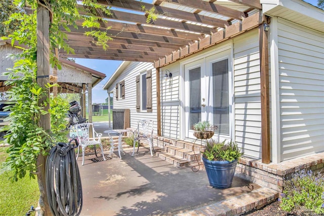 view of patio featuring french doors and a pergola