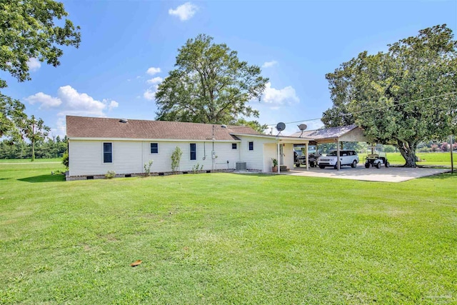 back of house with a yard, cooling unit, and a patio area