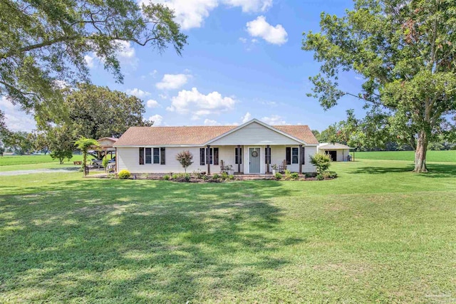 single story home featuring covered porch and a front lawn