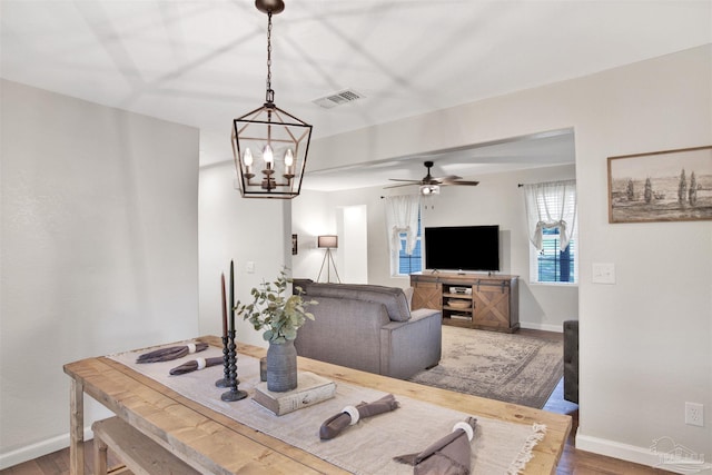 living room featuring hardwood / wood-style flooring and ceiling fan