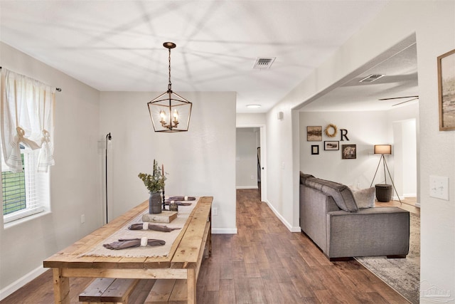 kitchen featuring an inviting chandelier and dark hardwood / wood-style floors