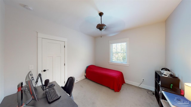 carpeted bedroom with ceiling fan