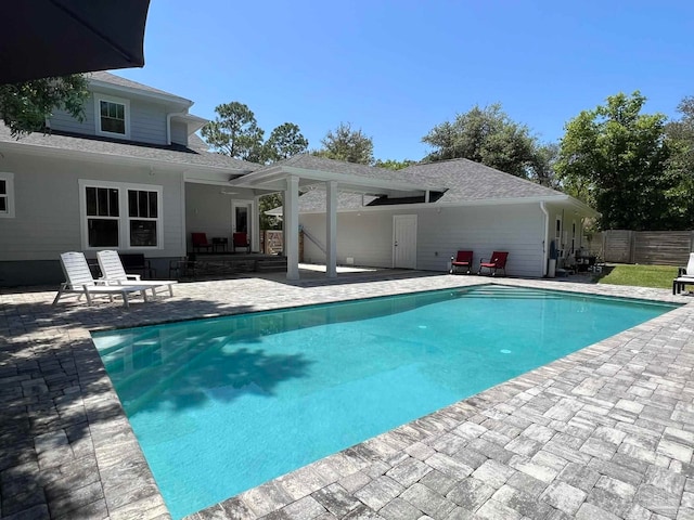 view of swimming pool with a patio