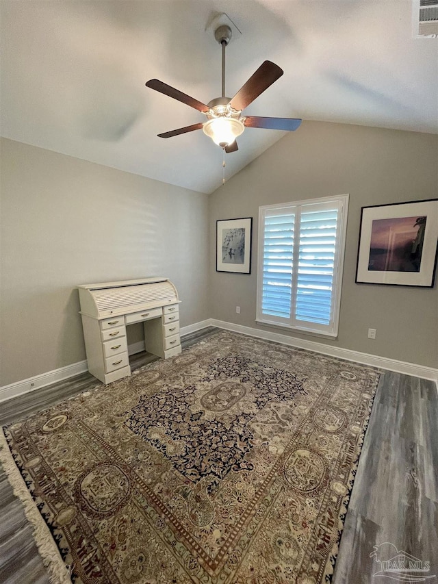 living room featuring ceiling fan, dark wood-type flooring, and lofted ceiling