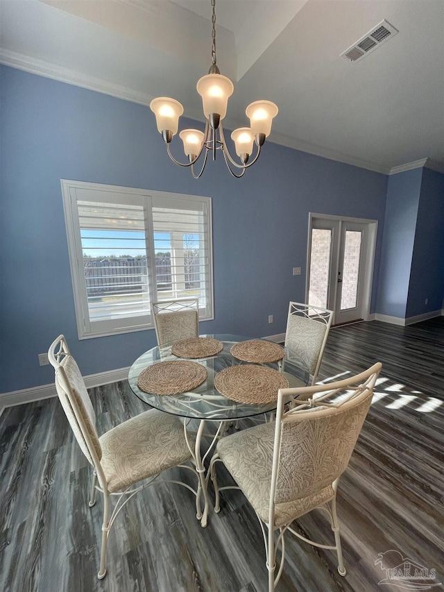 dining room featuring french doors, dark hardwood / wood-style floors, and a wealth of natural light