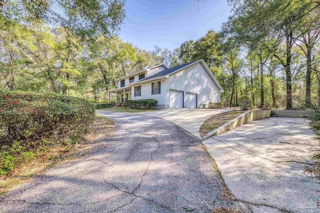 view of front of property with an attached garage and concrete driveway