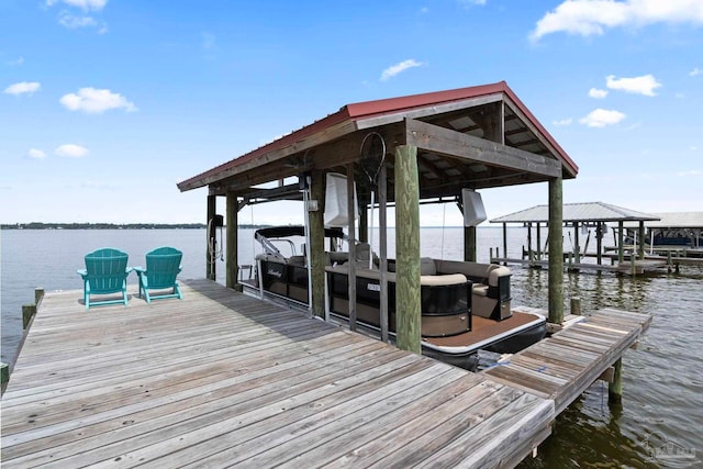 dock area featuring a water view