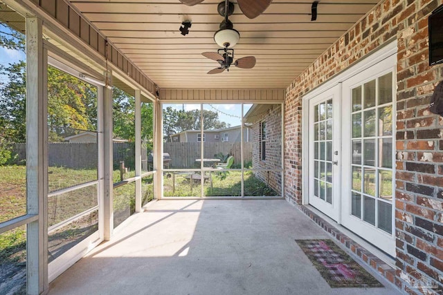 unfurnished sunroom with wood ceiling