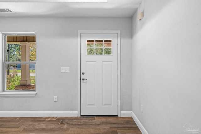 entryway with dark wood-type flooring