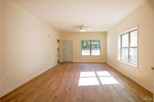 unfurnished room featuring hardwood / wood-style flooring and ceiling fan