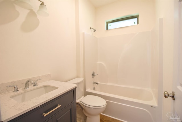 full bathroom with vanity, tub / shower combination, and toilet