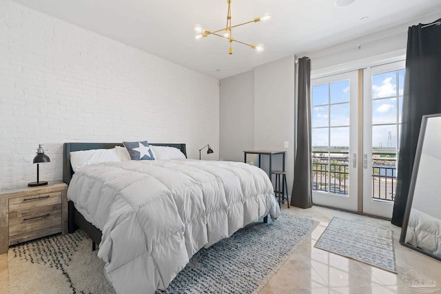 bedroom with multiple windows, access to outside, an inviting chandelier, and brick wall