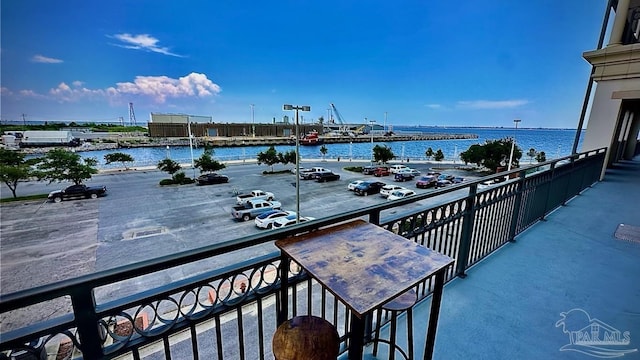 balcony featuring a water view