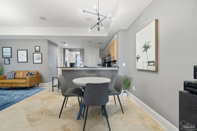 dining room with a chandelier