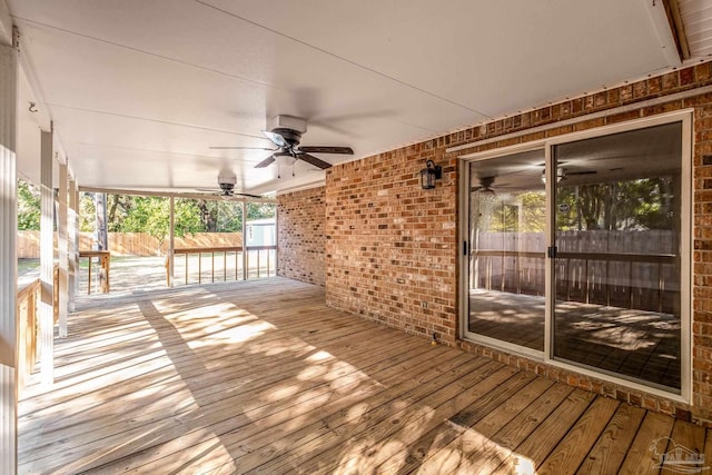 wooden deck with ceiling fan and covered porch