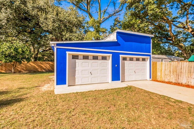 garage with a yard