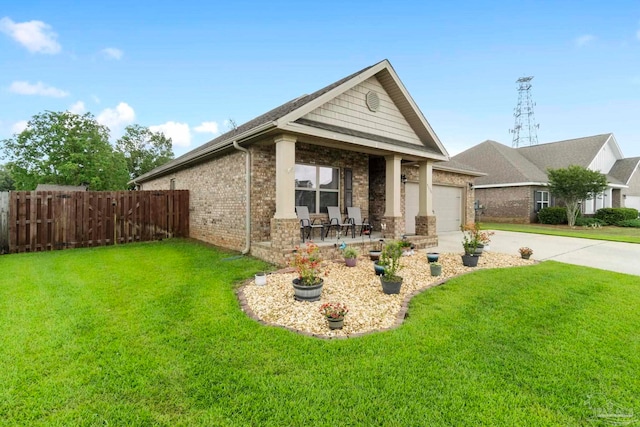 craftsman house with a garage and a front yard