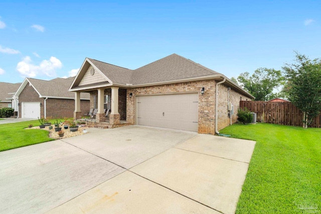 view of front of house with a front lawn and a garage