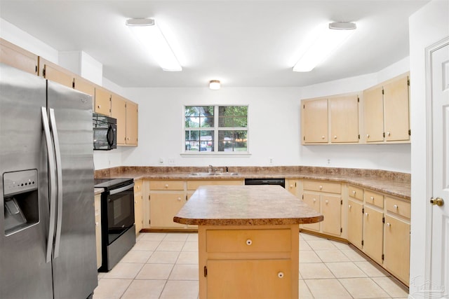 kitchen featuring light brown cabinetry, black appliances, light tile patterned flooring, and a kitchen island