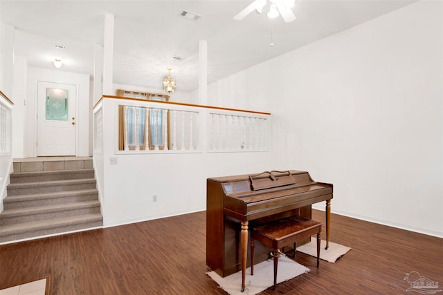 misc room with ceiling fan and dark hardwood / wood-style flooring