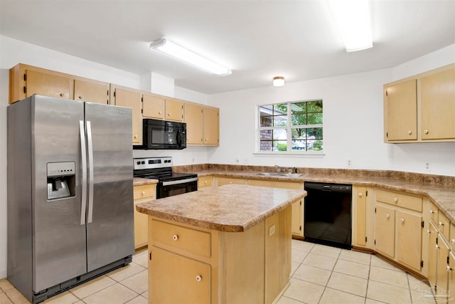 kitchen featuring light tile patterned floors, a center island, sink, and black appliances