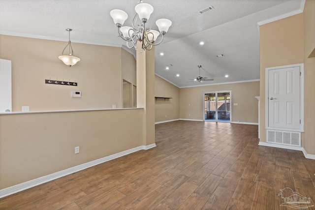 unfurnished living room featuring hardwood / wood-style flooring, a textured ceiling, vaulted ceiling, crown molding, and ceiling fan with notable chandelier