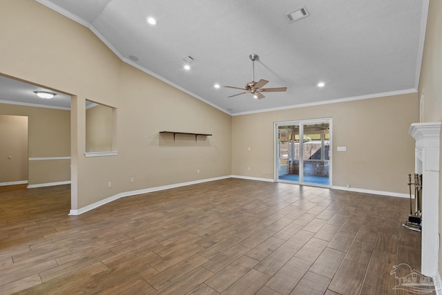 unfurnished living room featuring ceiling fan, a tile fireplace, lofted ceiling, and ornamental molding