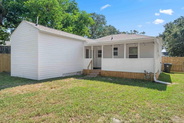 view of front of property with a front lawn