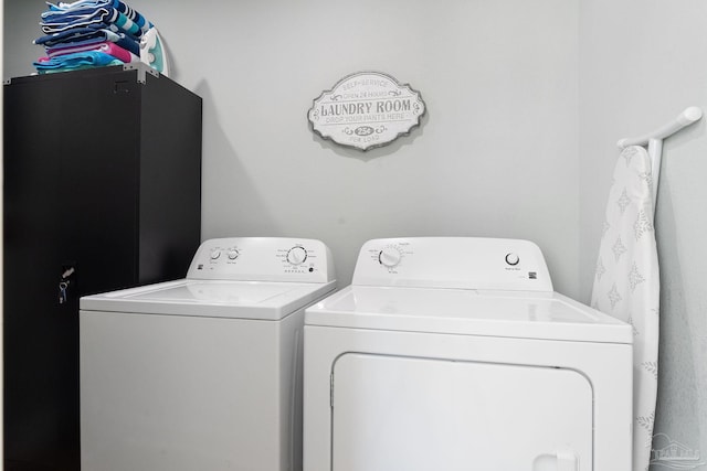 clothes washing area with washer and dryer