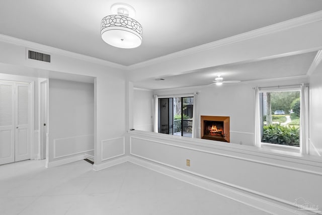 unfurnished living room featuring tile patterned floors, crown molding, and ceiling fan