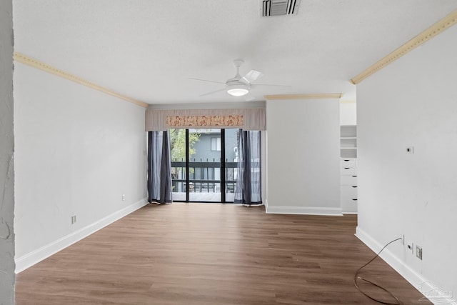 spare room with ceiling fan, hardwood / wood-style flooring, and ornamental molding