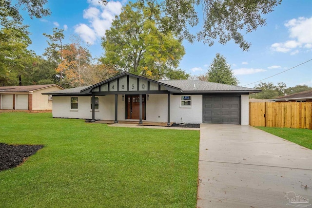 single story home with a porch, a garage, and a front yard