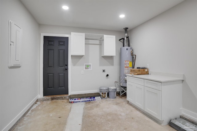 laundry room with cabinets, gas water heater, hookup for an electric dryer, electric panel, and hookup for a washing machine