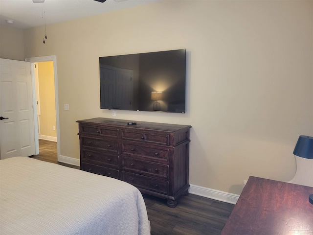 bedroom featuring ceiling fan and dark hardwood / wood-style floors