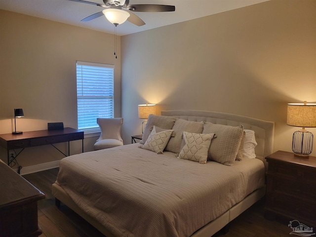 bedroom featuring dark hardwood / wood-style floors and ceiling fan