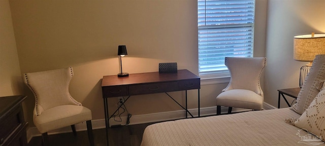 bedroom with hardwood / wood-style flooring