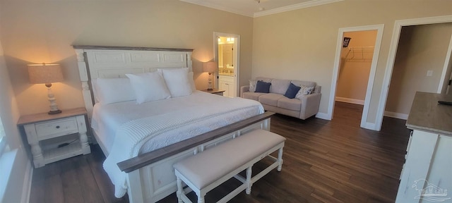 bedroom featuring a closet, ornamental molding, dark hardwood / wood-style flooring, and a walk in closet