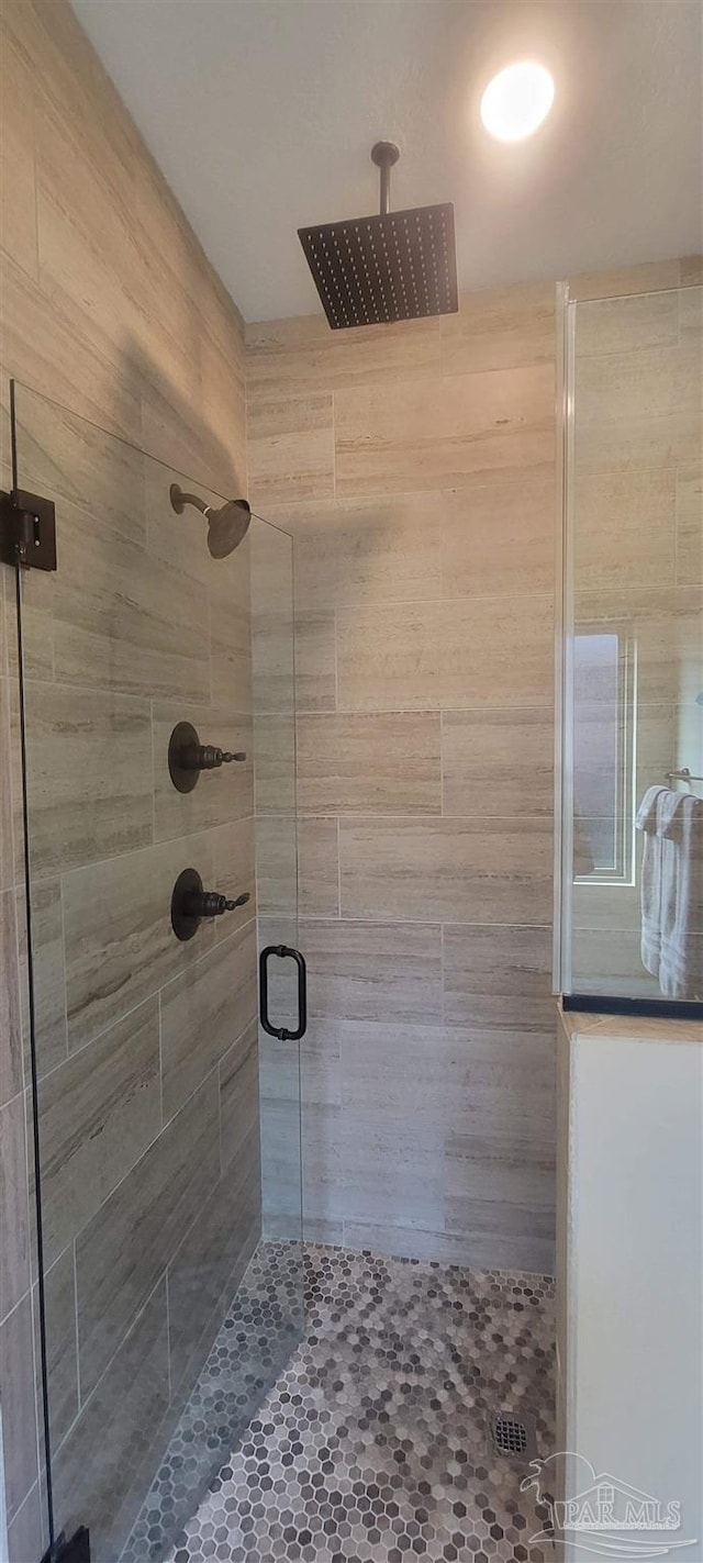 bathroom featuring an enclosed shower