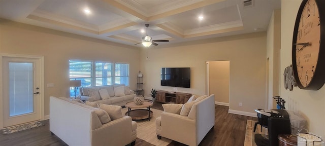 living room with dark hardwood / wood-style flooring, ceiling fan, coffered ceiling, beam ceiling, and ornamental molding