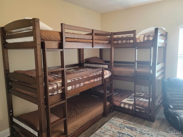 bedroom featuring dark hardwood / wood-style flooring