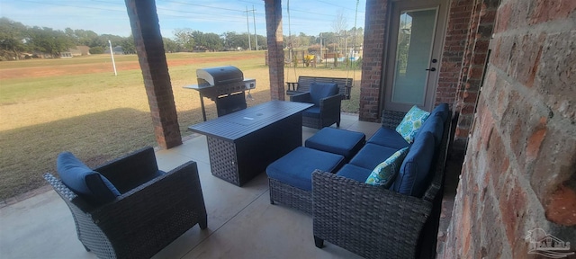 view of patio with outdoor lounge area and a grill